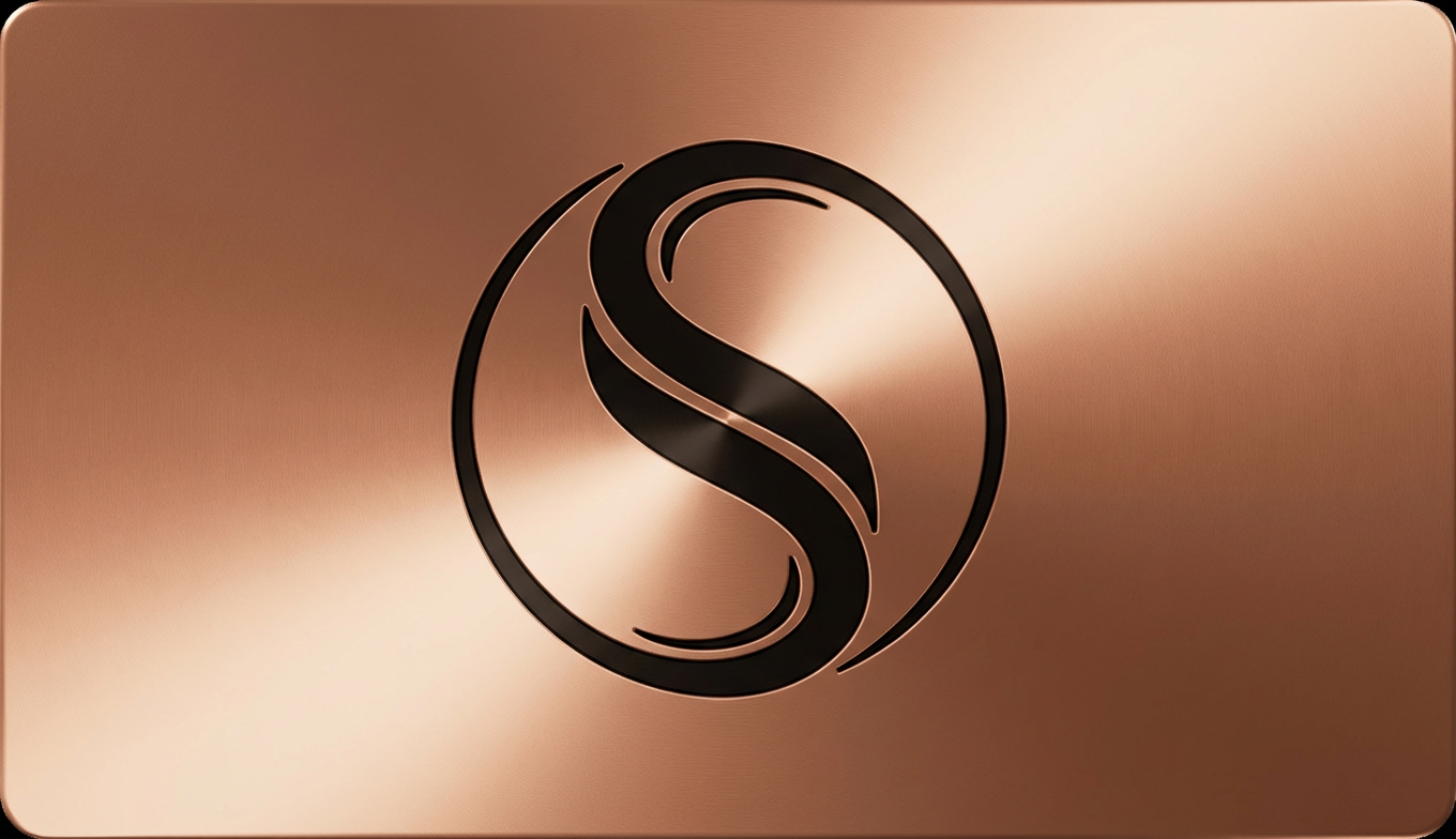 Premium metal business card with brushed copper finish and laser-engraved typography